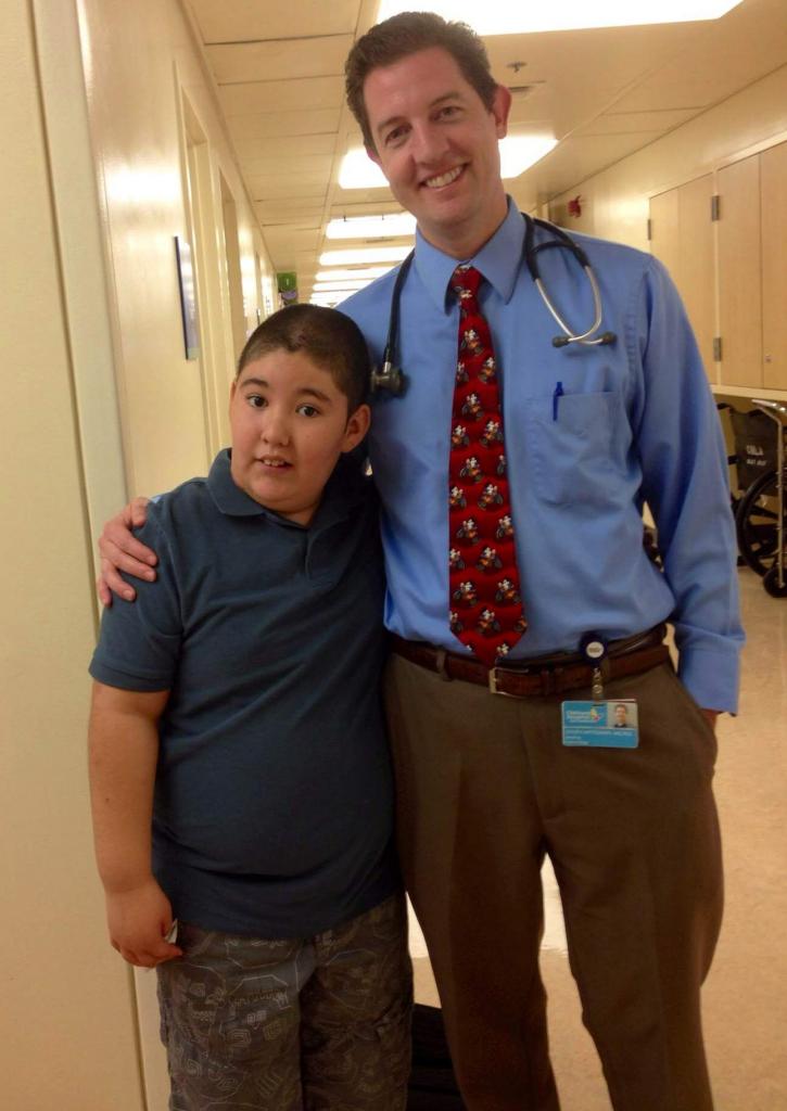 Steven Mittelman, M.D., Ph.D., shown here with a young patient, directs the Diabetes and Obesity program at Children's Hospital Los Angeles.