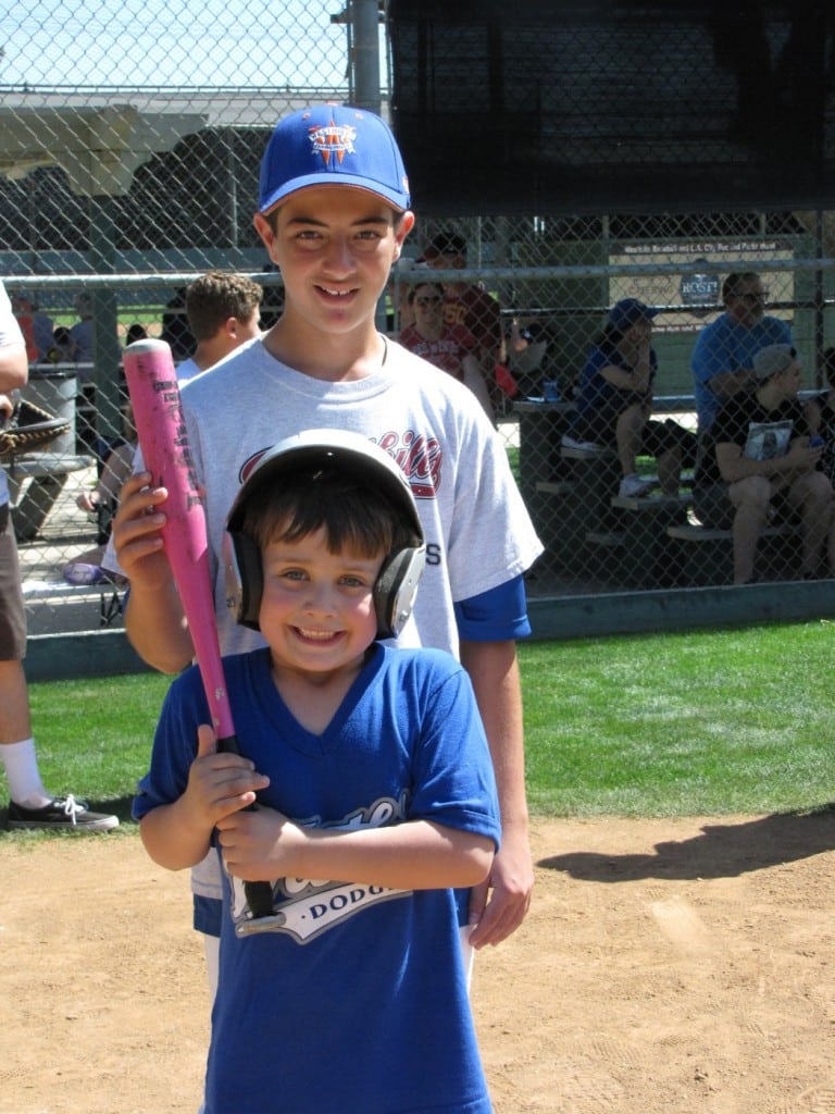 Kole Kodimer, top, founded the Westhills Champions baseball league for athletes with special needs, like his buddy Paul Ecklund. PHOTO BY GEORDAN NEINSTEIN