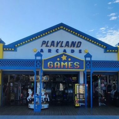 Front entrance of Playland Arcade on the Santa Monica Pier, celebrating its 71st anniversary as a historic, family-owned boardwalk arcade.