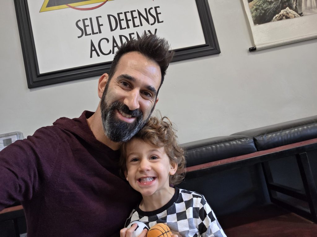 A father and son take a selfie.
