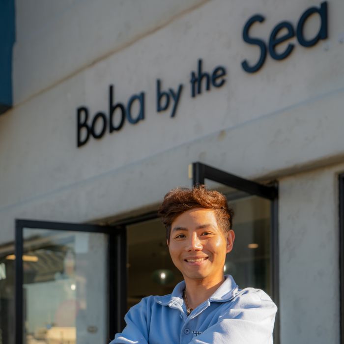 Boba by the Sea owner Quan Breault stands outside his family-friendly bubble tea shop in Ventura Harbor Village.